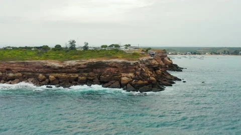 Cliffs  overlooking the blue-green waters of a tranquil lagoon Video stock 155797470