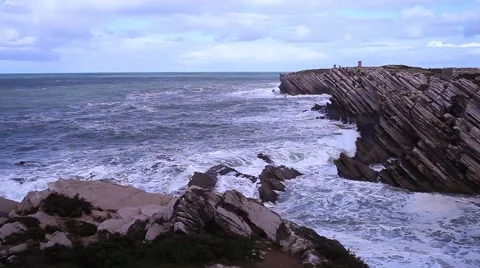Cliffs of rock with the ocean behind in Peniche Portugal Stock Footage 61171772
