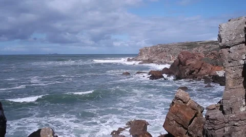 Cliffs of rock with the ocean behind in peniche portugal Video stock 63811494