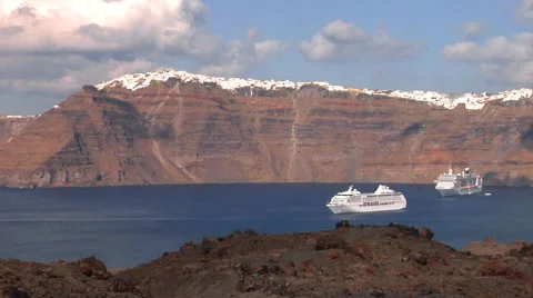 Cliffs of the Santorini island - camera pan from the volcano. Stock Footage 60925627