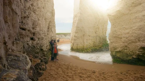 Cliffs at the seaside with people walking timelapse Video stock 74639462