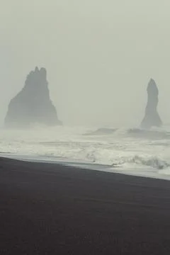Cliffs silhouettes on beach landscape photo Stock Photos