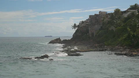 Cliffs with small houses above the ocean in Salvador de Bahia, Brazil Stock Footage 231529318