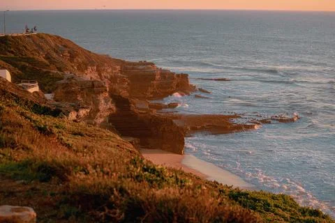 Cliffs at sunset - warm orange and teal tones 스톡 사진