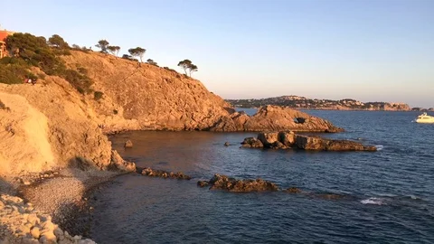 Cliffs with trees on the top in warm sunlight Stock Footage 71770631