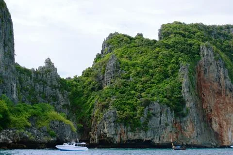 Cliffs on the tropical coast of Phi Phi islands, Thailand. Photos