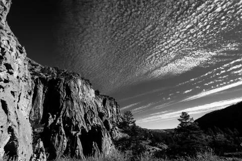 Cliffs under a cloudy sky. Stock Photos