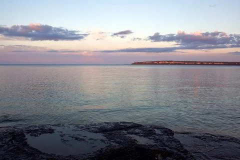 Cliffs, Water and Sunset Stock Photos