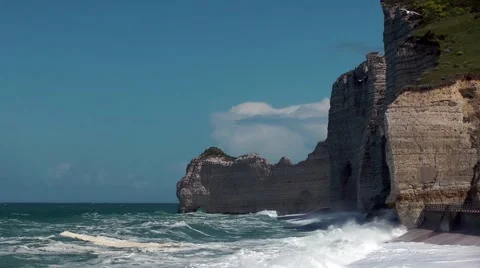 Cliffs waves white caps foam blue sky Stock Footage 60401121
