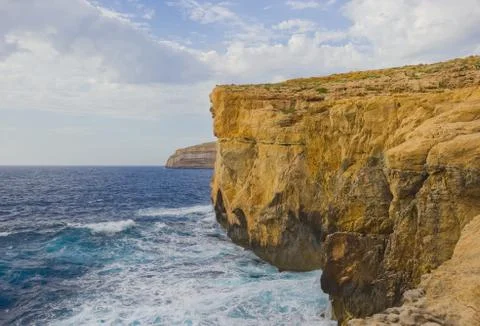 Cliffs where Azure Window collapsed lit by sunset light at the coast of Island Fotos de archivo