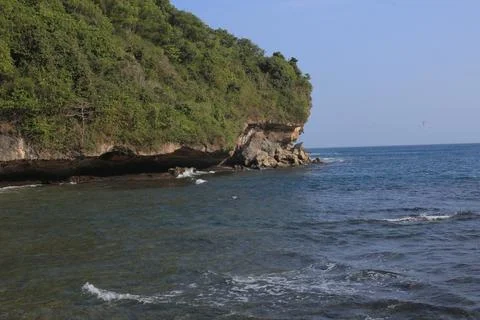 Cliffside Beach with Calm Waves Stock Photos