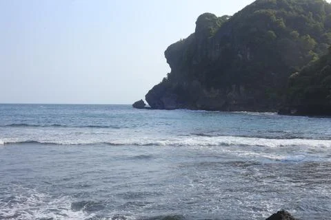 Cliffside Beach with Calm Waves Stock Photos