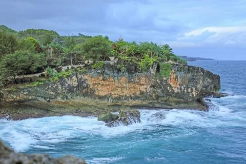 Cliffside Beach with Calm Waves Stock Photos