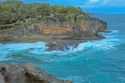 Cliffside Beach with Calm Waves Stock Photos