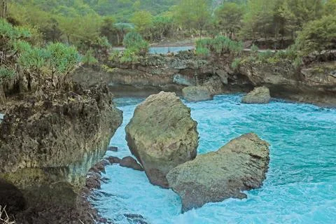 Cliffside Beach with Calm Waves Stock Photos