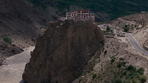 Cliffside Buddhist Monastery with Stupas above River in Himalayas Drone View Stock Footage 311554371