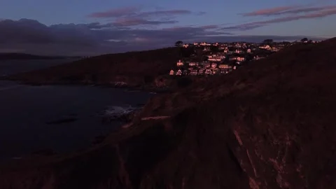 Cliffside Coastline at Sunset — Slow Lateral Drift with Human Scale Reveal Stock Footage 325855157