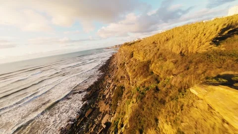 Cliffside coastlines bathed in soft morning light Stock Footage 340913671