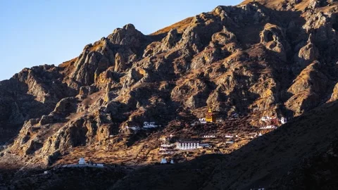 Cliffside Drak Yerpa monastery below rugged rock faces near Lhasa Stock-Footage 345881348