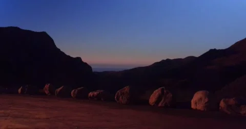 Cliffside landscape view of forest mountain sunset Stock Footage 136337297