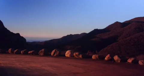 Cliffside landscape view of forest mountain sunset Stock Footage 136337411