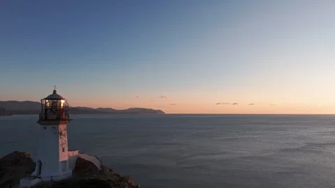 Cliffside Lighthouse Overlooking Ocean. 4K Video stock 266913359