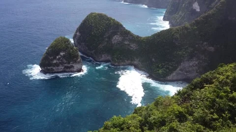Cliffside Marvel - Aerial Flight Over Kelingking Beach's Towering Cliffs Stock Footage 248315537