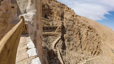 Cliffside Path with Ancient Structures Foto stock