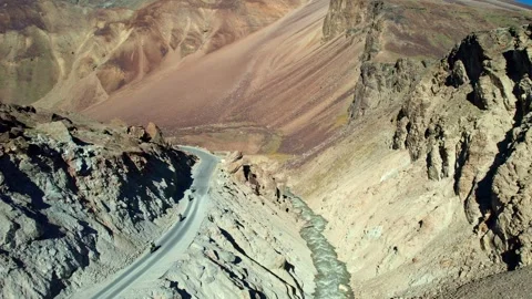 Cliffside Road with motobikes. Ravine With Winding Path. Aerial View Of Rocky Video stock 339341753