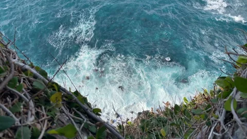 Cliffside Serenity: Aerial View of Waves Crashing on Shore Stock Footage 247421111