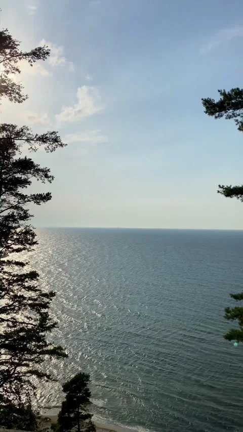 Cliffside View: Sunlight Dancing on the Water Stock Footage 272274590