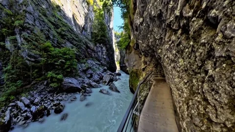 Cliffside Walkway Beside Rushing Turquoise River Stock Footage 344878265