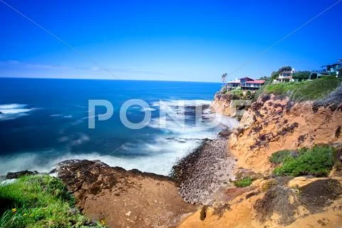 Clifftop home overlooking ocean Stock Photos