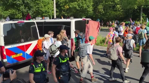 Climate activists blocking the A12 highway in The Hague Stock Footage 249935073