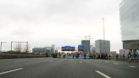 Climate activists blocking road. Amsterdam, Netherlands, 2024. Stock Footage 266170375