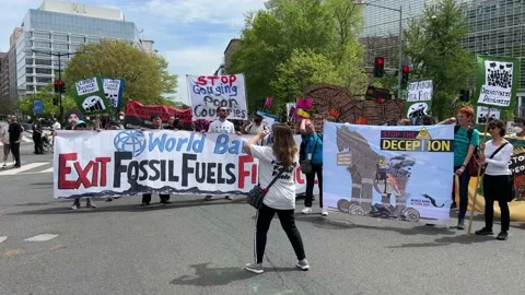 Climate activists protest outside IMF and World Bank headquarters Stock Footage 238542716