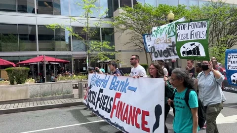 Climate activists protest outside IMF and World Bank headquarters Stock Footage 238542771