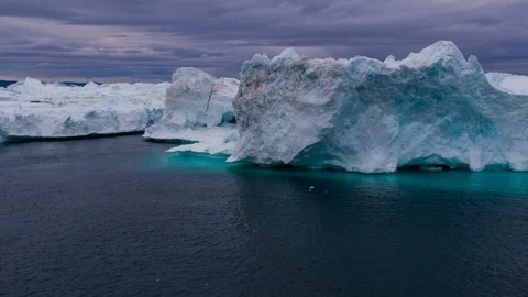 Climate Change and Global Warming - Icebergs from melting glacier in icefjord Video stock 88019315