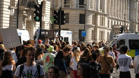 Climate Change Angry Protesters March towards Police Officers inside van Stock-Footage 116363381