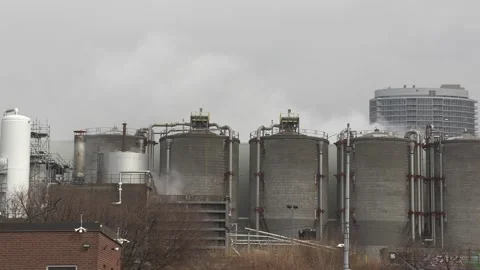 Climate change , carbon emissions  and gasses from industrial smokestack 库存影片 151238670