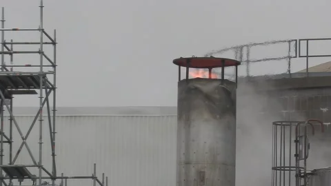 Climate change , carbon emissions flames and gasses from industrial smokestack Video stock 151238929