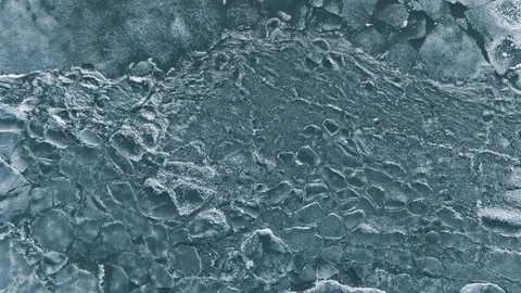 Climate change. Drone rises above the frozen crystal ice. Top view Stock Footage 107738009