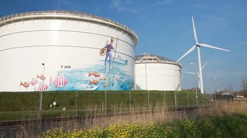 Climate change heaven and hell, an oil terminal in Amsterdam, Netherlands, wi 動画素材 235741788