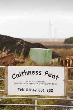 Climate change heaven and hell near Thurso in northern Scotland. A wind farm  Stock Photos