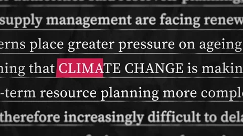 Climate Change Highlighted in Red on Simulated Article Text Stock Footage 343734569
