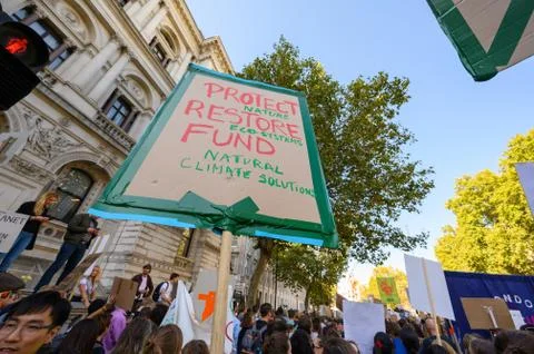 Climate Change protest placard held high at an Extinction Rebellion march Stock Photos