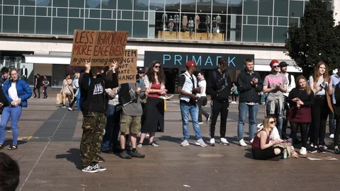 Climate change protesters applauding in Coventry Stock Footage 116347960
