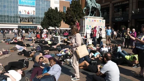 Climate change protesters lying down in Coventry city centre Stock-Footage 116345122