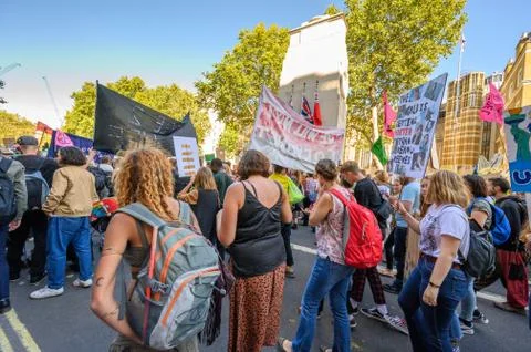 Climate Change protesters marching past The Cenotaph on Whitehall, London at  Stock Photos