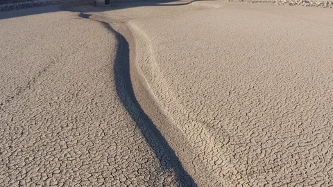 Climate change,global warming,drought.devastated farmer walking across dry dam Video stock 104608305